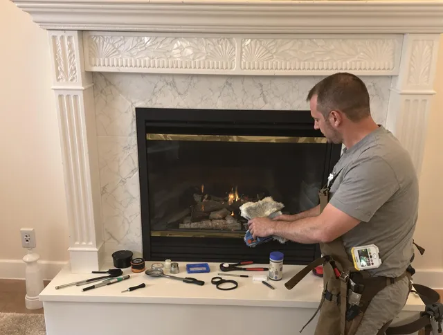 Westlake Chimney Sweep performing fireplace maintenance in Westlake, OH