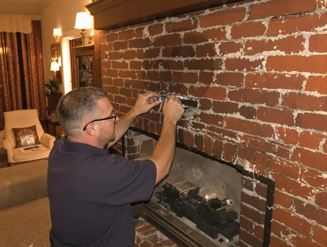 Westlake Chimney Sweep expert fixing a fireplace in Westlake, OH